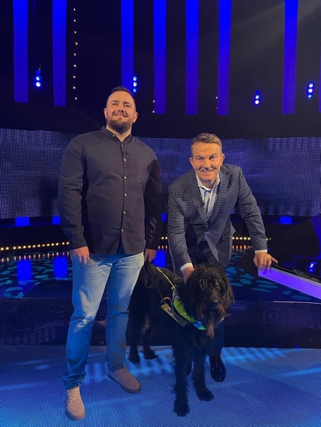 Lloyd Davies on the set of The Chase with guide dog Harvey in harness, plus quizmaster Bradley Walsh 