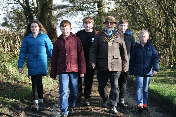 Carmarthenshire County Council chair walking with his family