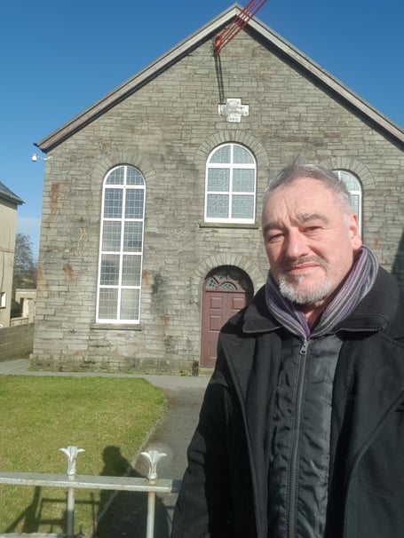 Cris Tomos outside Brynmyrnach Chapel, Hermon.