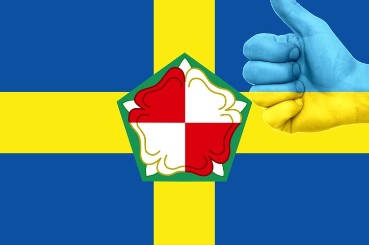 A medley of Pembrokeshire flag and a thumbs-up symbol in the colours of the Ukraine flag.