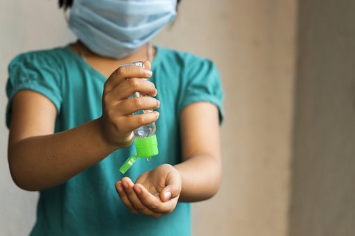 child with covid mask
