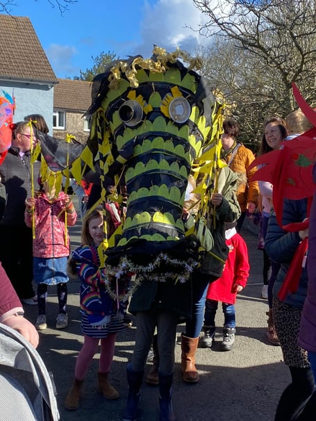 Local school children marched through the streets with their crafty dragon creations.