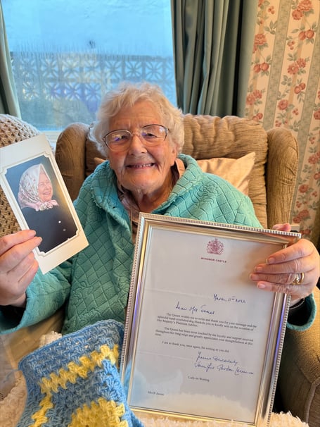 Betty James with her letter from the Queen
