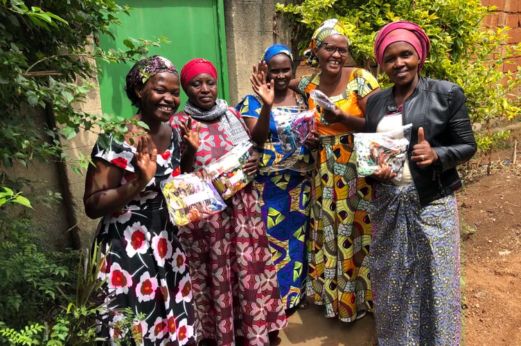 Kigali women with embroidery skeins donated from Pembrokeshire