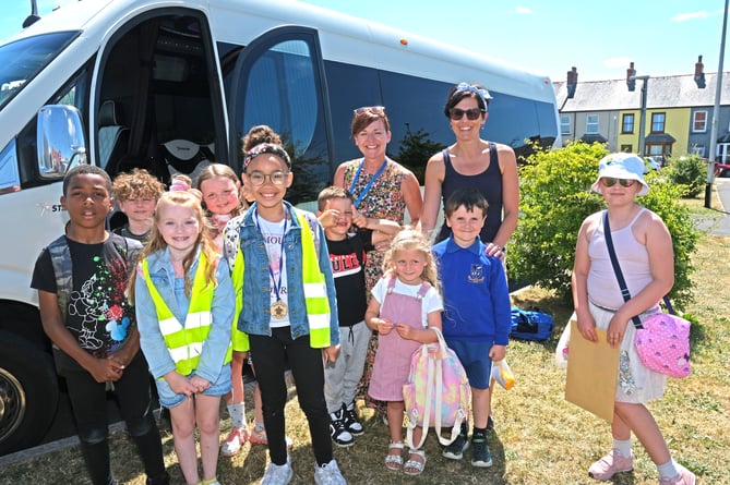 Neyland Walking Bus pupils enjoyed a luxury end of term treat. They are pictured with Headteacher Clare Hewitt and Assistant Headteacher Gemma Morris.