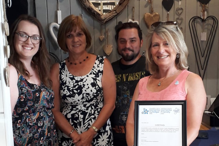 Lesley and her staff with Cherry Evans, Dementia Supportive Communities Development Officer, having been presented with the Dementia Friendly certificate.