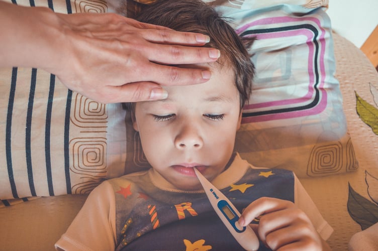 Child with thermometer