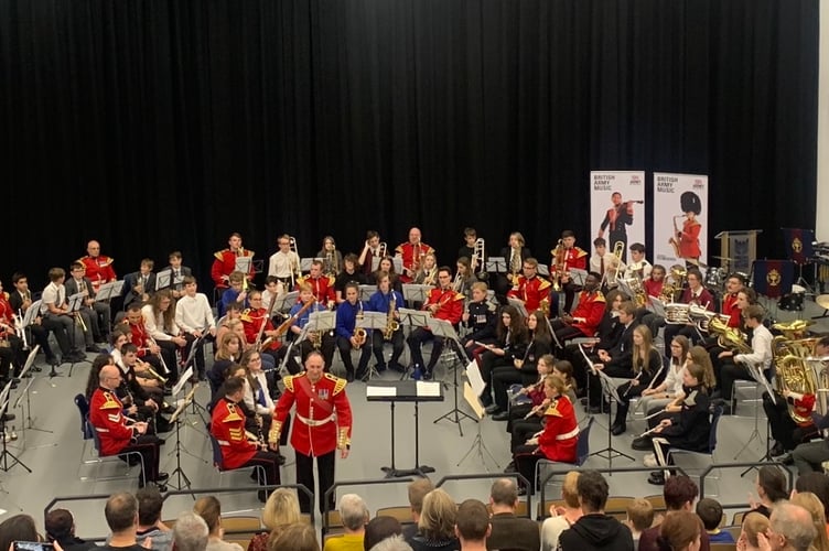 Pembrokeshire Music Service pupils and Band of Welsh Guards at a Haverfordwest VC High School concert