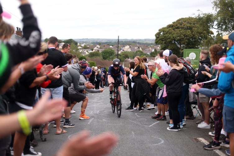 TENBY, WALES - SEPTEMBER 11: Participants compete in the cycle leg of the race during the IRONMAN Wales on September 11, 2022 in Tenby, Wales. (Photo by Charlie Crowhurst/Getty Images for IRONMAN)