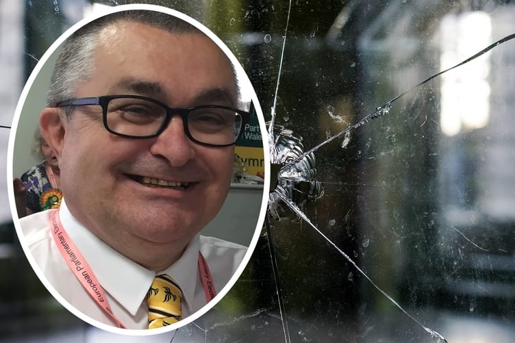 Liberal Democrat Pembrokeshire spokesman Andrew Lye inset on a smashed pane of glass indicating burglaries going unsolved