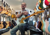 TV crew visiting Pembroke check out guitar George