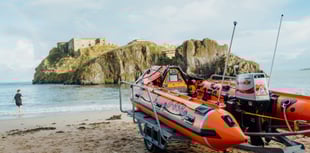Paddleboarder rescued after clinging to buoy near Tenby