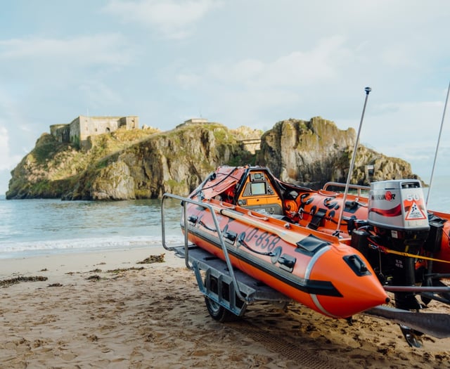 Paddleboarder rescued after clinging to buoy near Tenby