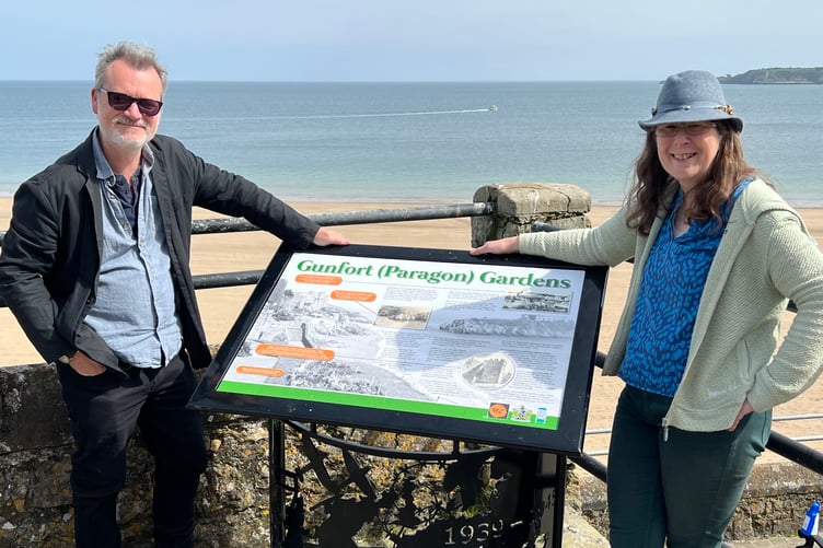 Mark Lewis with Tenby Community Engagement Officer Anne Draper with the new interpretive board at Gunfort Gardens.
