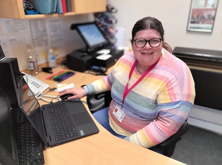 Kath working on the reception desk at the Haverfordwest Hub.