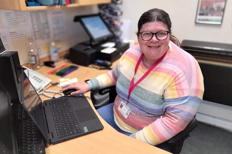 Kath working on the reception desk at the Haverfordwest Hub.