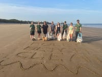Folly Farm team cleans up Tenby South Beach for World Refill Day