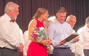 Soloists Corey and Celyn receive mementos from Tenby Choir Chair Terry Evans