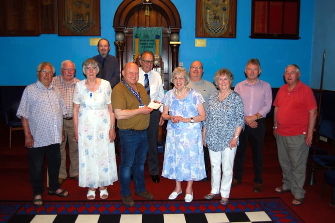 Worshipful Master, W.Bro Steven Evans presenting a cheque for £250 to representatives of Talking Books Wales. An application has been made to the Province to match fund the donation taking it to £500. The Worshipful Master was accompanied by Brethren from the Narberth Lodge.