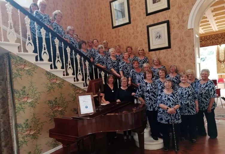 On their visit to St Brides Castle, the ladies of Neyland Ladies Choir were invited to have a photograph on the grand staircase before being served with light refreshments in the lounge and on the terrace. It was a beautiful sunny evening and the venue seemed rather different from the previous concert on a wet and windy evening in November.