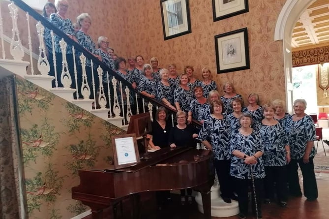 On their visit to St Brides Castle, the ladies of Neyland Ladies Choir were invited to have a photograph on the grand staircase before being served with light refreshments in the lounge and on the terrace. It was a beautiful sunny evening and the venue seemed rather different from the previous concert on a wet and windy evening in November.