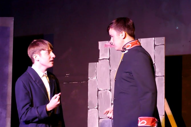 Rhys Williams as Jean Valjean, confronting Javert, played by Iestyn Finch.