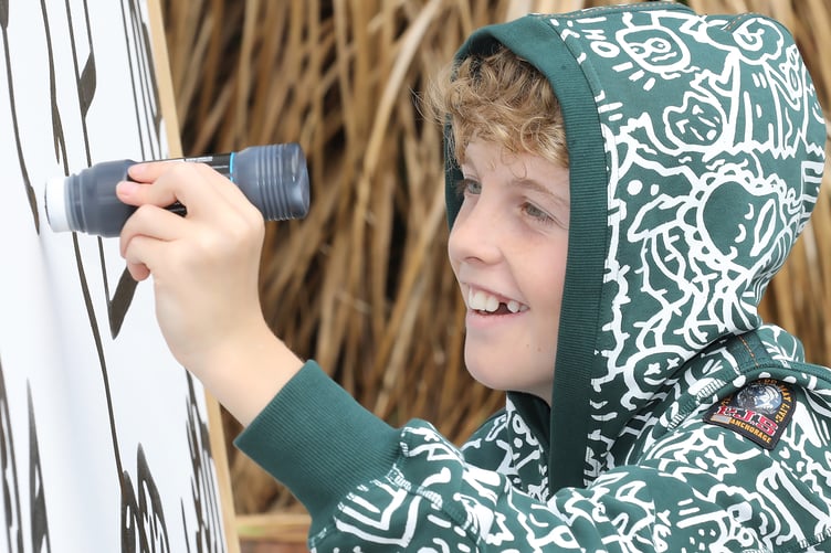 13 year old Shrewsbury artist Joe Whale aka The Doodle Boy at Shrewsbury Town Library working on his masterpiece.