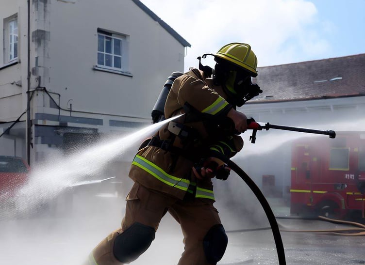Firefighter with hose