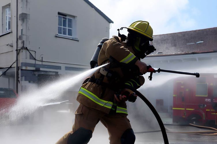 Firefighter with hose