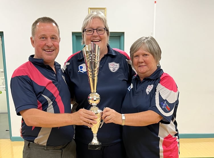Club Captain Sharon Harper-Green is pictured presenting the trophy to Pairs winners Mark Taylor and Paula Jacobs.