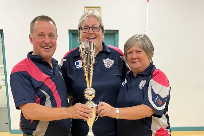 Club Captain Sharon Harper-Green is pictured presenting the trophy to Pairs winners Mark Taylor and Paula Jacobs. 