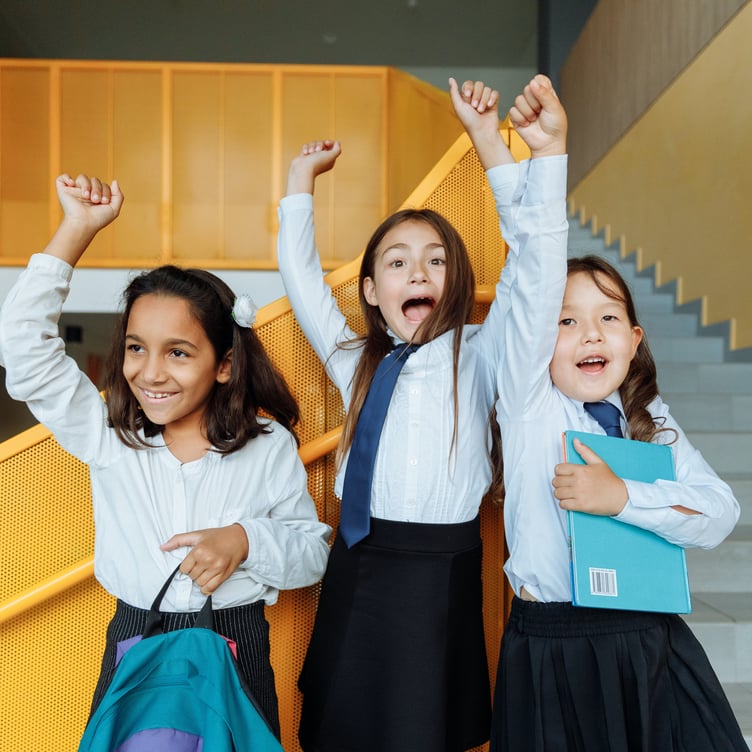 https://www.pexels.com/photo/cheerful-students-raising-their-hands-8926850/
