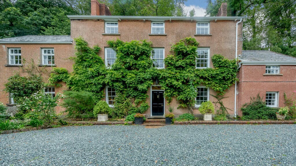 Former mill house for sale sits in seven acres of woodlands and borders a river