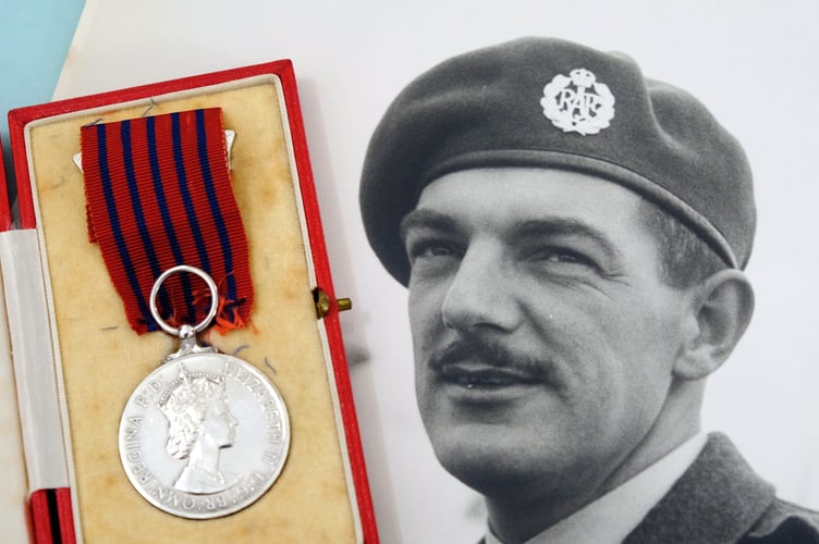 The George Medal and Flight Sergeant Evansâ photograph.