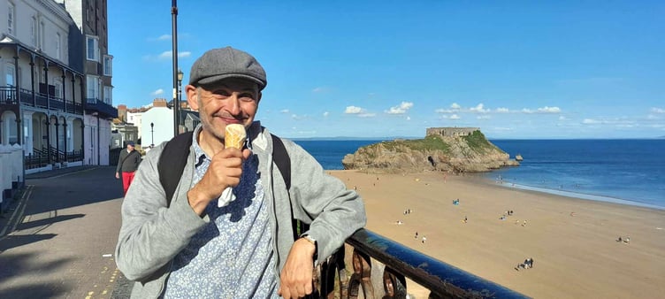 Writer and performer Robert Cohen fulfilling a childhood dream in returning to Tenby, seen sampling a Welsh cake-flavoured ice-cream on the Paragon.