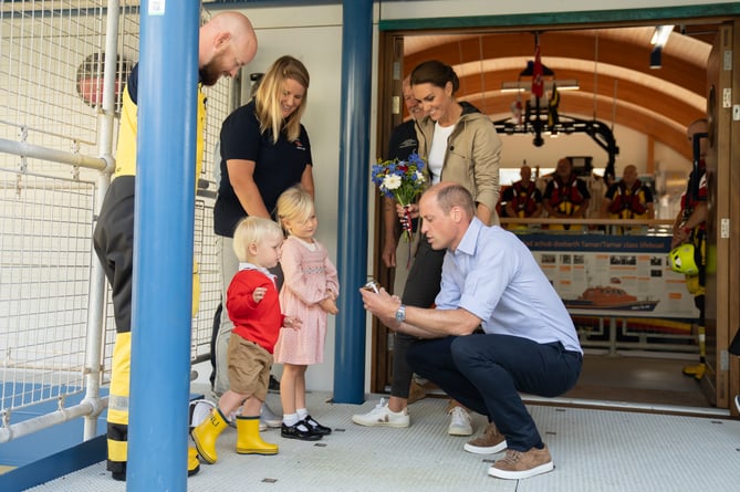 HRH The Prince and Princess of Wales with Isla and Albert, children of Deputy Coxswain Judd Kohler and crew member Ellen Evans.