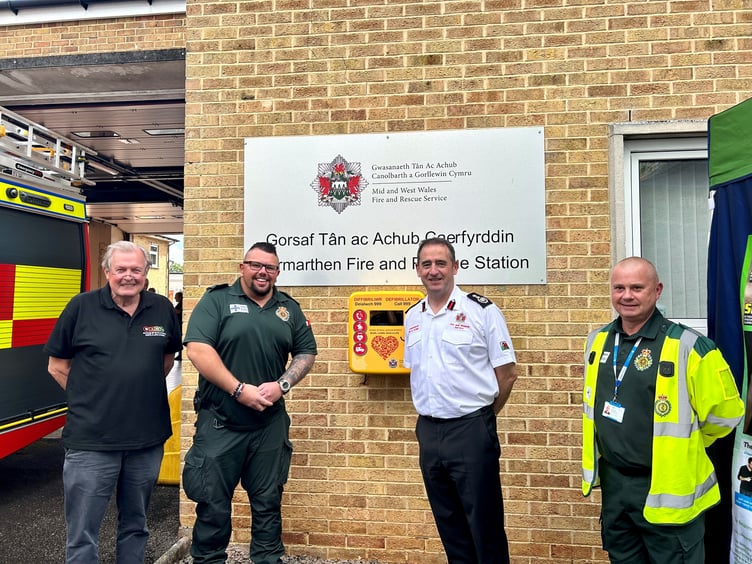 From left to right: Save a Life Cymru Chair Professor Len Nokes, Nick Ozzati from the Welsh Ambulance Service Trust, Chief Fire Officer Roger Thomas and Save a Life Cymru Community Co-ordinator Marc Gower.