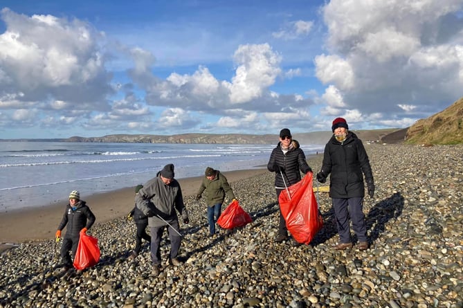 The Roots to Recovery project litter picking on the beach