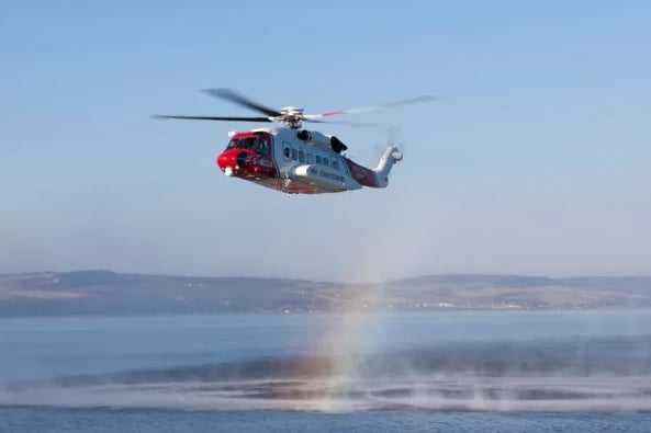 Coastguard helicopters from South Wales and Newquay tried to rescue two men trapped near Minehead.