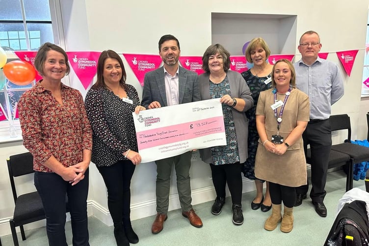 Stephen Crabb MP presenting the cheque at the Day service Launch on Wednesday, September 27. Pictured are Cllr Di Clements; trustee Jane Smith; Stephen Crabb MP; trustee Gill Leese; Laura Long Ð Share the Care; trustee Cherry Evans and David Howlett, representing Paul Davies AM.