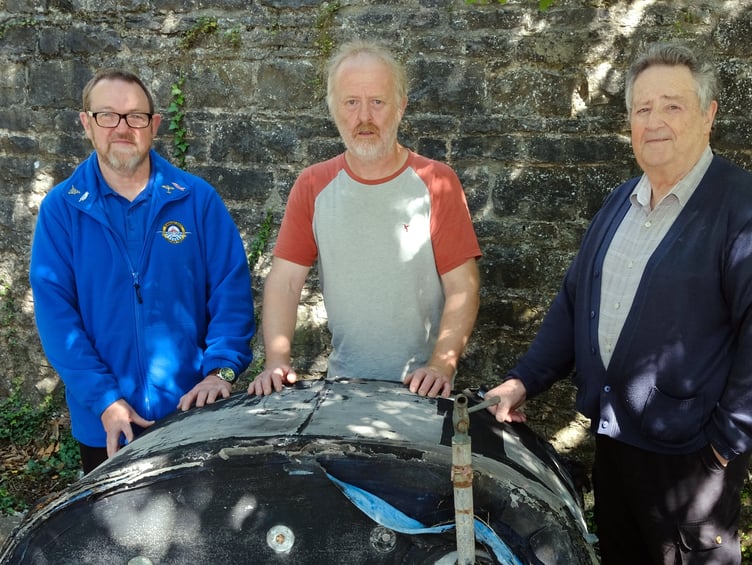 Barry Davies (centre) shows the Sunderland fuel tank to Heritage Centre Volunteers Paul Emens (left) and Malcolm Miles.