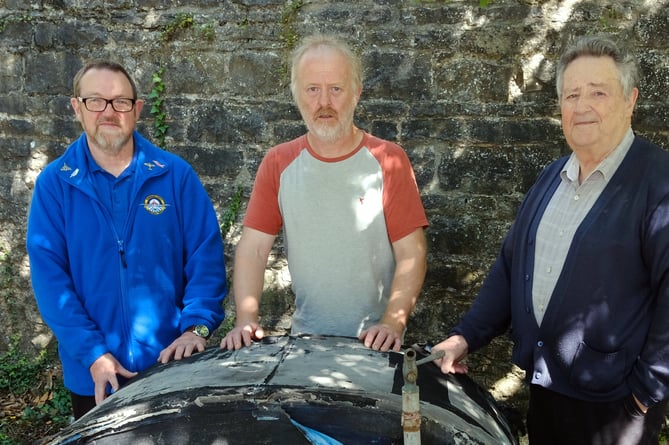 Barry Davies (centre) shows the Sunderland fuel tank to Heritage Centre Volunteers Paul Emens (left) and Malcolm Miles.