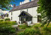 "Impressive" farmhouse for sale comes with riverside woodlands 