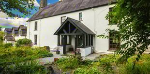 "Impressive" farmhouse for sale comes with riverside woodlands 