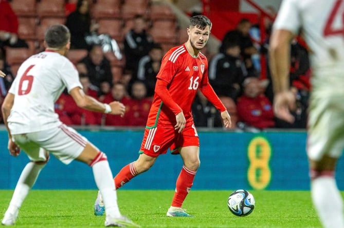 Liam in action for Wales