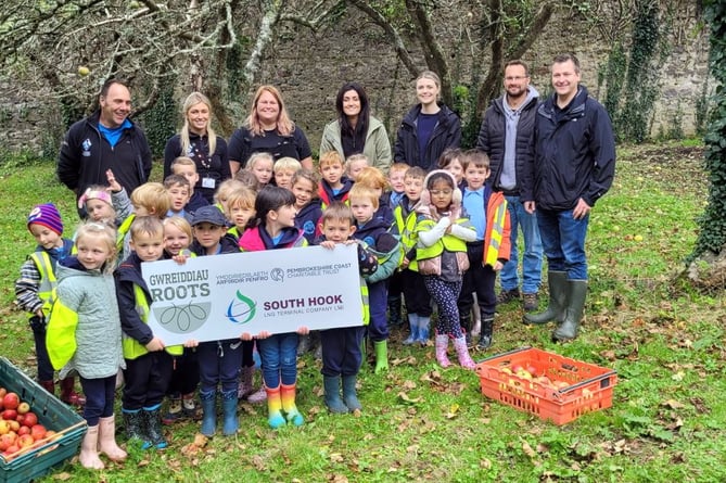 Pupils from St Francis Catholic School, Milford Haven are pictured alongside staff from the Park Authority, the Pembrokeshire Coast Charitable Trust and South Hook LNG.