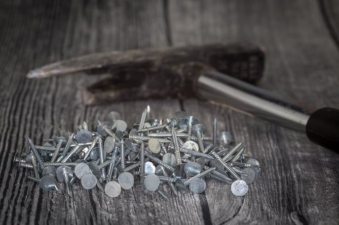 Stock image of wood, hammer and nails