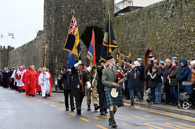 Leading the procession along Tenby’s South Parade is piper Graham Phillips, from Pembroke.