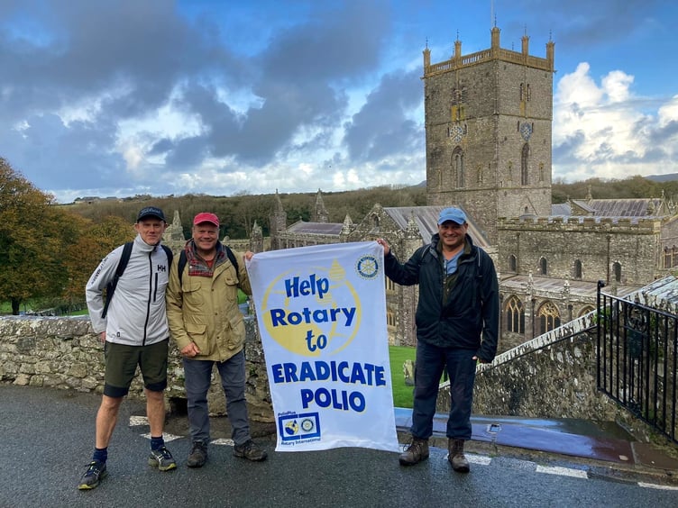 A wet, but smiling trio of Saundersfoot Rotarians helping to eradicate Polio with their walk around the St Davids peninsular coast path.