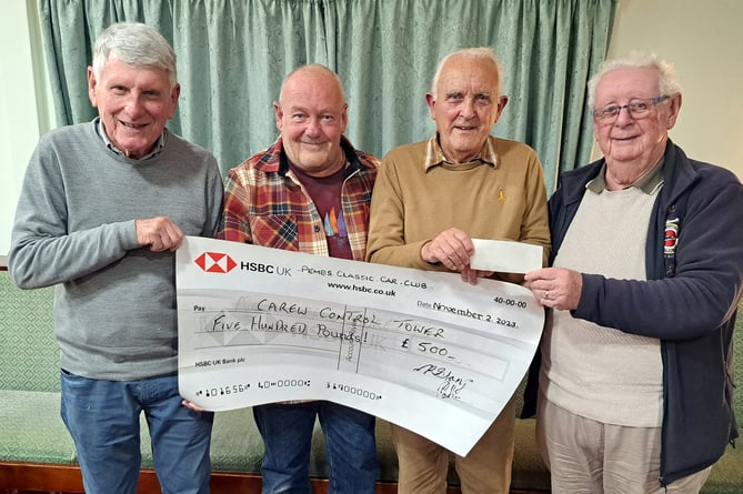 Club Vice Chairman Dave Esmond presenting a cheque for £500 to Martin Hyde, Carl Lawton and Keith Hamer of Carew Control Tower